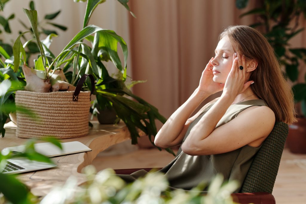 A woman having a Headaches and Migraines